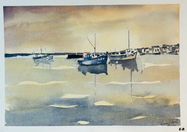 Couché de soleil sur les bateaux de pêche au port